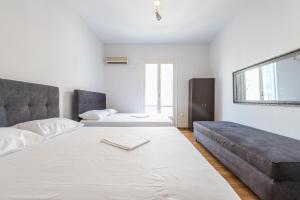Posteľ alebo postele v izbe v ubytovaní Victoria Majesty Apartments