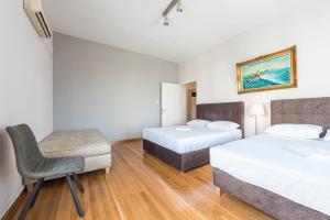 Posteľ alebo postele v izbe v ubytovaní Victoria Majesty Apartments