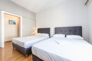 Posteľ alebo postele v izbe v ubytovaní Victoria Majesty Apartments
