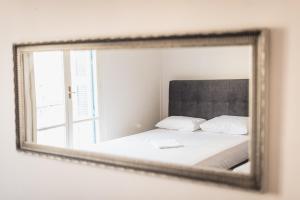 Posteľ alebo postele v izbe v ubytovaní Victoria Majesty Apartments