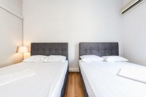 Posteľ alebo postele v izbe v ubytovaní Victoria Majesty Apartments