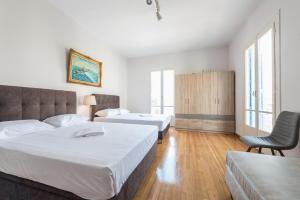 Posteľ alebo postele v izbe v ubytovaní Victoria Majesty Apartments