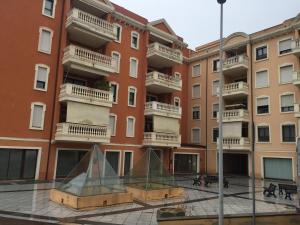a building with a pyramid in front of it at Via Acquedotto n. 66, Condominio "Le Piramidi" in Olbia