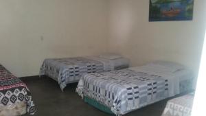 Ένα ή περισσότερα κρεβάτια σε δωμάτιο στο Hospedaje Eli Panajachel