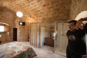 A bed or beds in a room at Casa Mur de Alujan