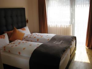 Letto o letti in una camera di Hotel Pizzeria Selva