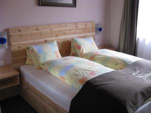 Letto o letti in una camera di Hotel Pizzeria Selva