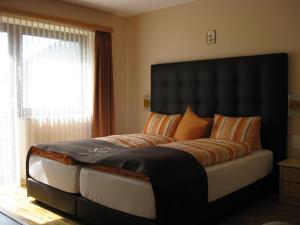 Letto o letti in una camera di Hotel Pizzeria Selva