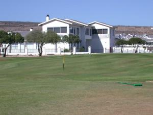 a golf green with a hole in the grass at Makarios B&B in Langebaan