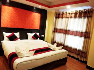Voodi või voodid majutusasutuse Kathmandu Regency Hotel toas