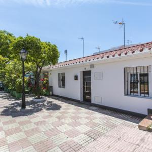 a white building with a street light in front of it at Casa Alma in Marbella