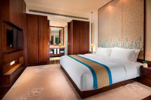 Voodi või voodid majutusasutuse Banyan Tree Huangshan toas