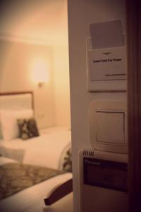 Postel nebo postele na pokoji v ubytování Cebeciler Hotel