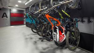 a group of bikes are lined up in a bike rack at Pangea Pod Hotel in Whistler