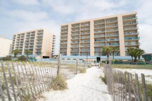 a building on the beach in front of a building at Surfside Shores II 2905 in Gulf Shores