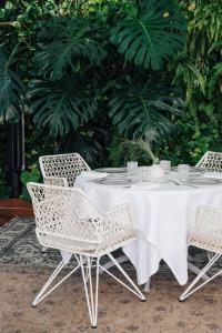 a table with two chairs and a white table cloth at Claris Hotel & Spa GL, a Small Luxury Hotel of the World in Barcelona