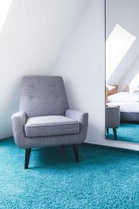 Postel nebo postele na pokoji v ubytování Ulmer Münster Hotel