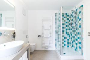 Koupelna v ubytování Ulmer Münster Hotel + 37 fotografií