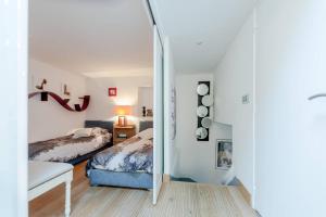 Llit o llits en una habitació de Elegante appartmento nel quadrato d'oro a St Tropez
