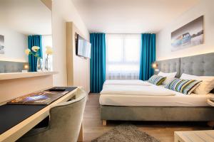 Postel nebo postele na pokoji v ubytování Home Hotel