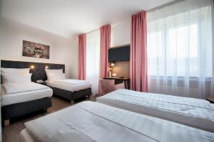 Postel nebo postele na pokoji v ubytování Home Hotel