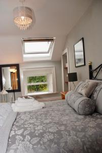 a bedroom with a large bed and a window at Tranquility in Longford