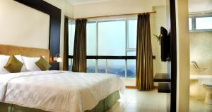 Cama o camas de una habitación en Marbella Suites Bandung