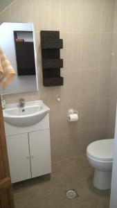 Kúpeľňa v ubytovaní Komissa΄s Beach House