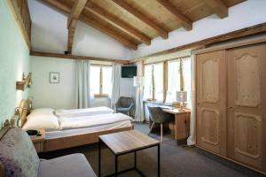 Ένα ή περισσότερα κρεβάτια σε δωμάτιο στο Hotel Alphorn