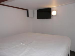 En eller flere senge i et værelse på Le 12 Pierres - Croix-Rousse - Cosy & Design