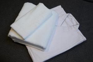 a stack of white napkins sitting on a table at Rinn Gion Kenninji in Kyoto