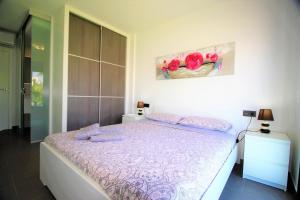 Cama o camas de una habitación en Oasis Beach Gabriel