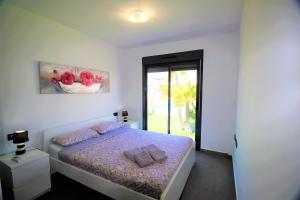 Cama o camas de una habitación en Oasis Beach Gabriel