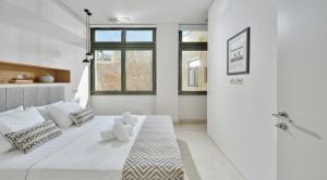 Lova arba lovos apgyvendinimo įstaigoje Thission Luxury Homes & SPA by K&K