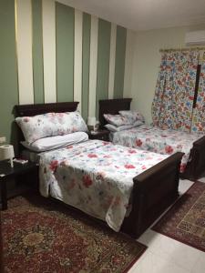 En eller flere senger på et rom på 112 AUC Residence