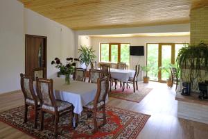 a dining room with a table and chairs at Chez Yvette in Garni