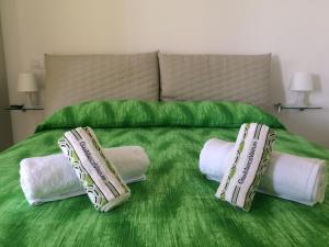 A bed or beds in a room at B&B Adele