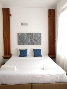 Postel nebo postele na pokoji v ubytování Cozy by Funwahn