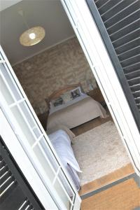 Un pat sau paturi într-o cameră la Casa Amarela