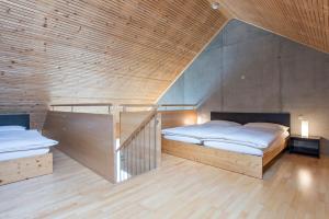 全能酒店 - 旅馆住宿/瑞士小屋客房内的一张或多张床位