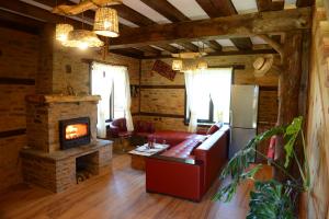 a living room with a couch and a fireplace at Dream house in Leshten