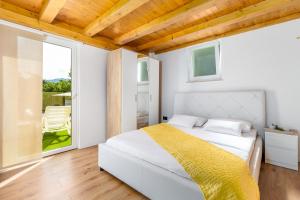 Postel nebo postele na pokoji v ubytování Villa Angeli + 22 fotografií