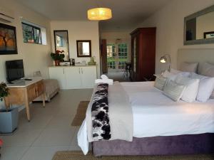Ein Bett oder Betten in einem Zimmer der Unterkunft Radium Hall Guest House
