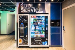a cold service refrigerator in a store at ibis budget Geneve Saint Genis Pouilly in Saint-Genis-Pouilly