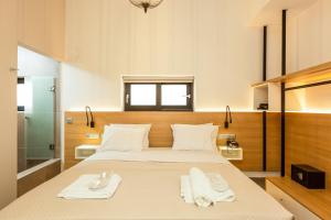 Postel nebo postele na pokoji v ubytování T Hotel Premium Suites
