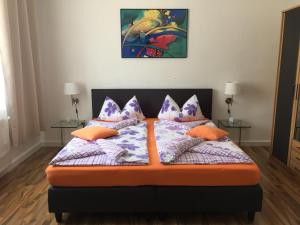 a bedroom with a bed with pillows on it at Lorenz Apartment in Hattingen
