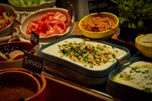 a buffet filled with different types of food in trays at Bikini Island & Mountain Port de Soller "Adults only" in Port de Soller
