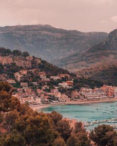 a town on the shore of a body of water at Bikini Island & Mountain Port de Soller "Adults only" in Port de Soller