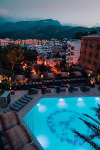 a large swimming pool on top of a building at Bikini Island & Mountain Port de Soller "Adults only" in Port de Soller