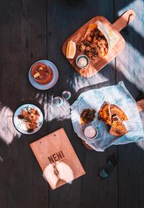 a table with food and plates of food on it at Bikini Island & Mountain Port de Soller "Adults only" in Port de Soller